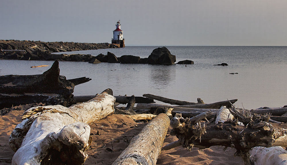Wisconsin Point, Driftwood and Lighthouse by Randen Peterson / Wikimedia