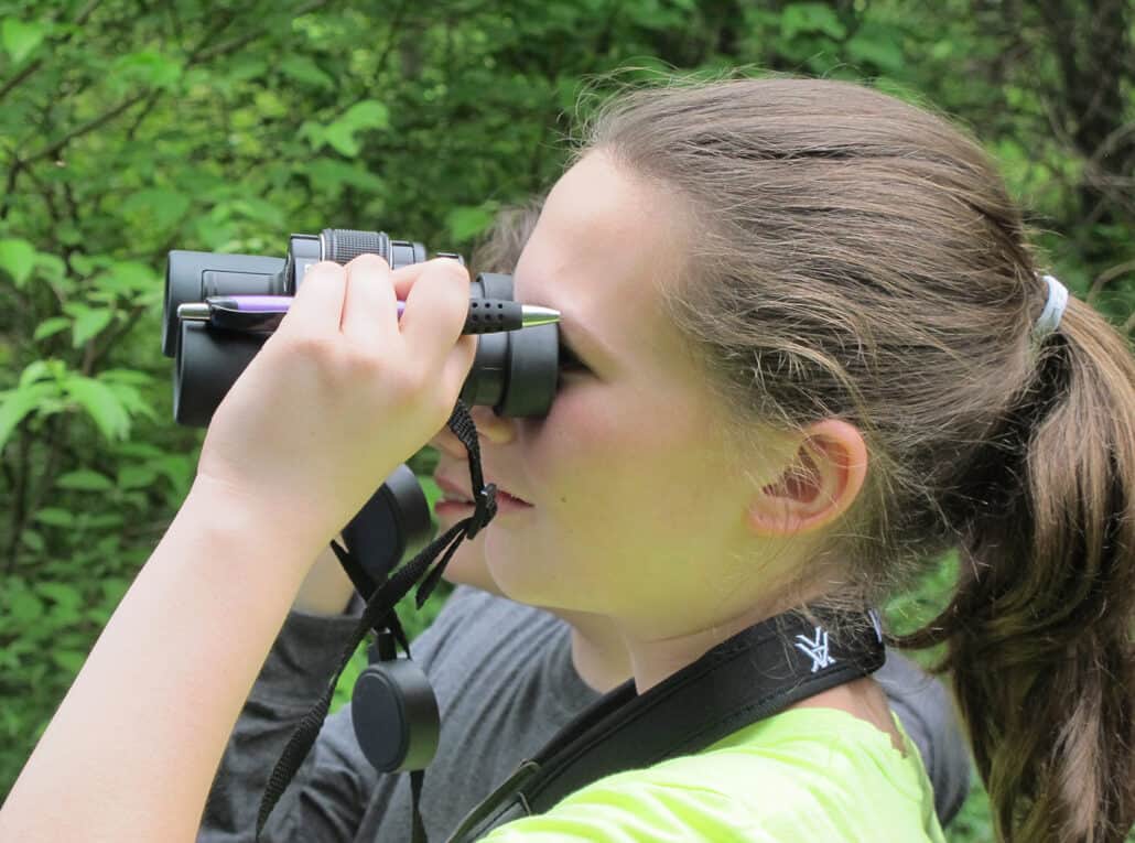 Young birder with binoculars. Photo by Bill Thompson, III.
